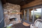 Outdoor Fireplace and screened in porch off of dining area